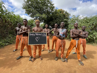 African Orange Pants Team